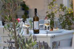 Open garden restaurant Naoussa Paros Greece dressed table